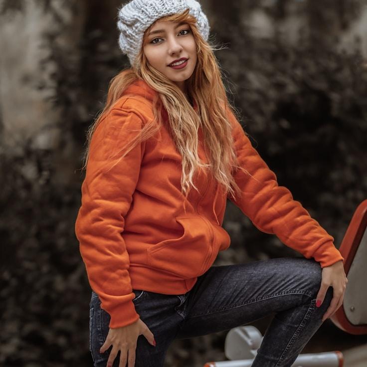 Asha Malik, Lead Design Curator at Whistle Paper Trail, reviewing corporate floral arrangements